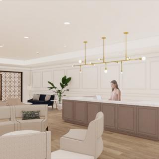 A modern reception area with neutral colors and minimalist design, featuring a lounge and a central chandelier.