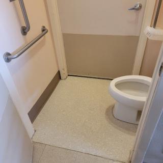 A clean and accessible bathroom with a toilet.