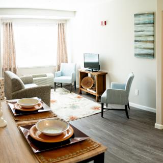 Modern living room with dining area and cozy seating.
