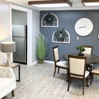 A modern dining and living area with stylish decor and furnishings.