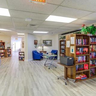 A cozy library space with bookshelves and a comfortable reading area.