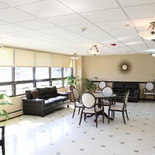 A well-lit lounge area featuring comfortable seating and elegant furniture.