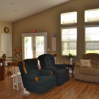 A cozy living room with comfortable seating and natural light.