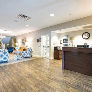 A modern lobby area with comfortable seating and a reception desk.