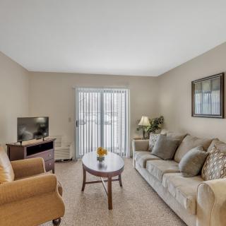 A cozy living room with comfortable seating and natural light.