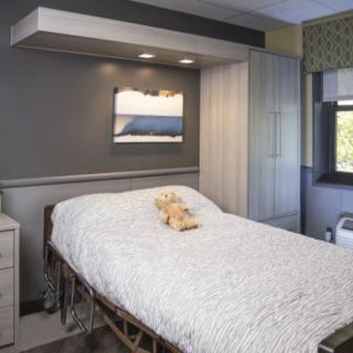 A modern and cozy bedroom with a neatly made bed.