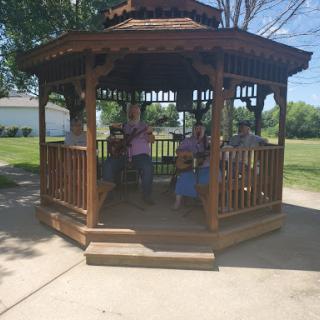 A lively performance in a charming gazebo at the park.
