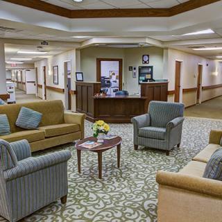 A welcoming lobby area with comfortable seating and a reception desk.