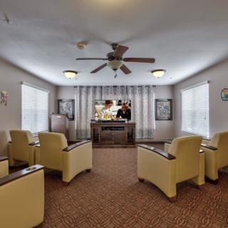 A cozy living area with comfortable seating and a television.