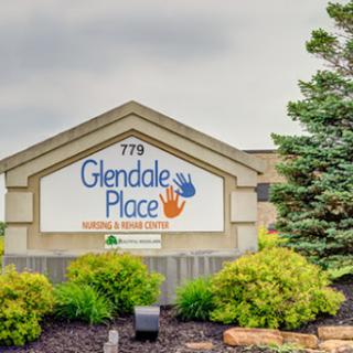 The entrance signage of Glendale Place Nursing and Rehab Center, surrounded by neatly trimmed shrubs.