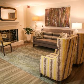 A cozy living room with modern furniture and warm lighting.