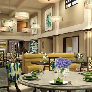 A stylish restaurant interior with modern decor and elegant table settings.