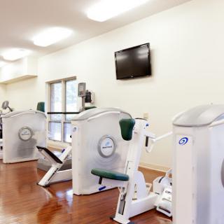 A well-equipped gym featuring various exercise machines for fitness enthusiasts.