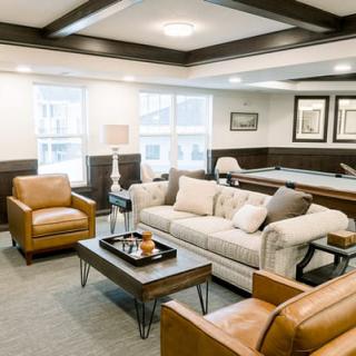 A stylish living room with modern furniture and elegant decor.