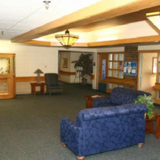 A cozy lobby with comfortable seating and warm lighting.