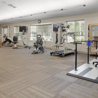 A spacious gym featuring various exercise machines and equipment for workouts.