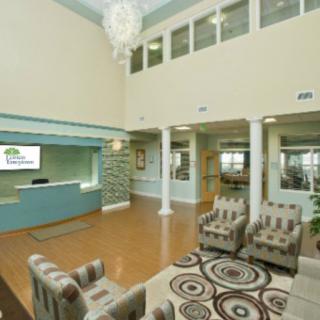A modern lobby with comfortable seating and a reception desk.