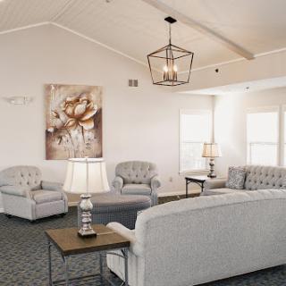 A cozy living room featuring elegant furniture and modern decor.
