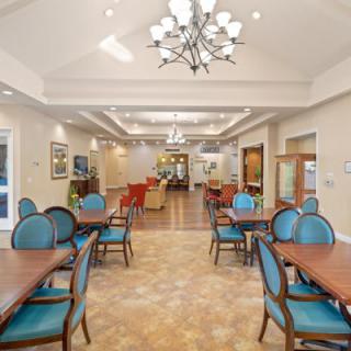 A spacious and elegantly designed dining area with modern furnishings.