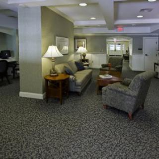 An indoor lobby area with comfortable seating and ambient lighting.