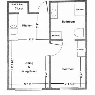 A floor plan of a one-bedroom apartment featuring a kitchen, bathroom, and combined dining and living room area.