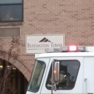 Burlington Tower with an emergency vehicle parked nearby.