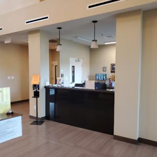 A modern reception area featuring sleek design and minimalist decor.