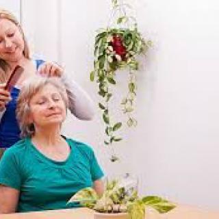 A woman enjoying a relaxing hair care session indoors.