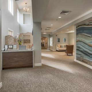 A modern reception area featuring stylish decor and comfortable seating.