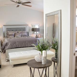 A stylish and modern bedroom featuring elegant furnishings and a serene ambiance.