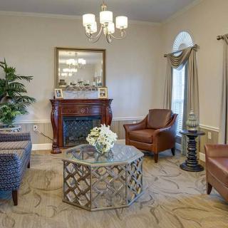 Elegant living room with a cozy fireplace and stylish furniture.