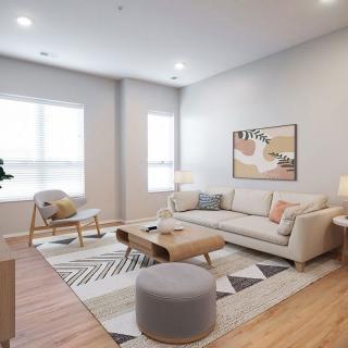 A modern living room with stylish furniture and warm natural lighting.