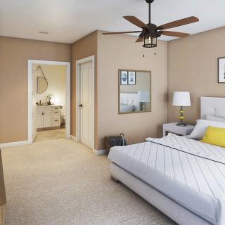 A modern bedroom with neutral tones, featuring a comfortable bed, ceiling fan, and stylish decor.