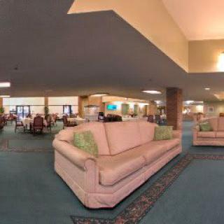 A spacious lobby area featuring comfortable sofas and stylish interior decor.