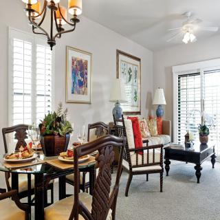 A cozy dining and living area with elegant furnishings and tasteful decor.