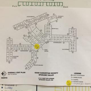 A detailed floor plan of a building, showing various rooms and pathways marked for navigation.