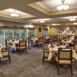 A beautifully arranged dining room featuring elegant tables and chairs, perfect for a relaxing meal.