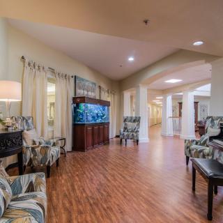 A spacious lobby area with an aquarium and ample seating arrangements.
