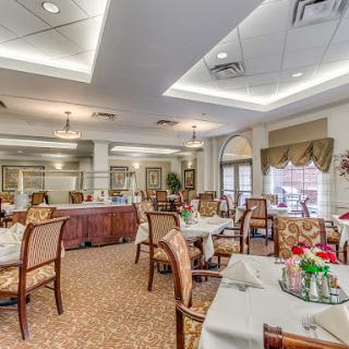 A beautifully designed dining area featuring elegant tables and chairs, ideal for fine dining.