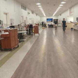 A spacious interior of a hospital facility with medical equipment and staff.