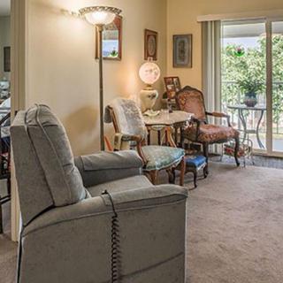 A cozy living room with comfortable seating and natural light.