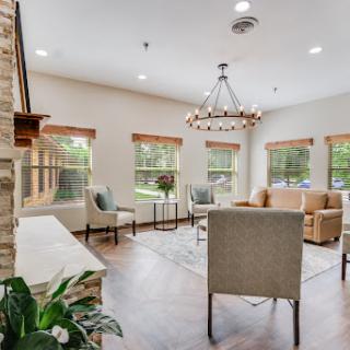 A cozy and modern living room designed to maximize natural light with elegant furnishings.