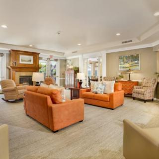 A cozy living room with comfortable seating and a fireplace.
