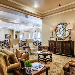 A cozy and elegantly decorated living room with comfortable seating and stylish decor.