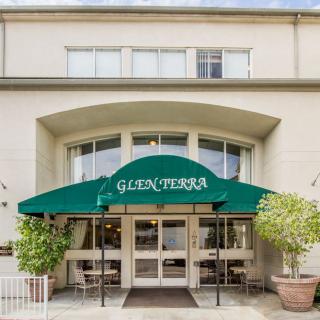Entrance of a building with a green awning labeled 'Glen Terra'.