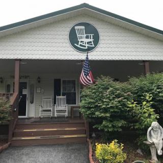 A welcoming home with a charming porch and a hint of Americana.