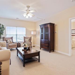 A cozy living room featuring elegant furniture and warm lighting.