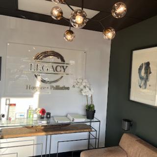 Modern office reception with stylish decor and ambient lighting.