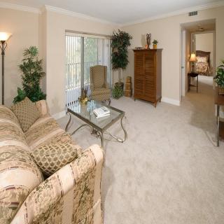A cozy living room with comfortable seating and elegant decor.
