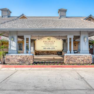 Front view of a building entrance with prominent signage and architectural details.